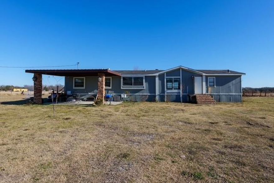Escape to peaceful country living on 7.5 fully fenced acres in tranquil Wills Point, TX--where wide-open space meets easy access to Dallas. This charming manufactured home features 3 bedrooms and 2 full baths with an open-concept floor plan designed for comfort and connection. The spacious kitchen offers ample counter and cabinet space and flows seamlessly into the living area. anchored by a cozy fireplace and filled with natural light from large windows throughout. Less than 3 miles from Lake Tawakoni!!

Outside, the possibilities are endless. Bring your horses, raise chickens, or simply create your own outdoor retreat--whether that's a fire pit under the stars, a garden, or room to roam. Enjoy the peace, privacy, and slower pace of country life while still being just a short drive from city conveniences. This is Texas living at it's best! Horses, Homesteading & USDA vibes can all be yours!
