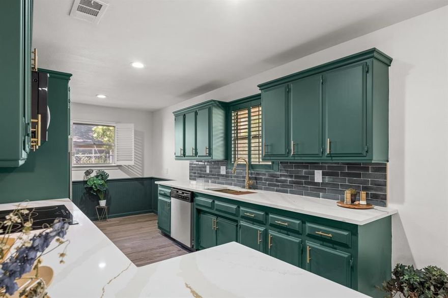 BEAUTIFULLY UPDATED AND MOVE-IN READY, this 3-bedroom, 2-bath home blends modern style with everyday comfort. Wood-look ceramic tile flows throughout for easy maintenance, complemented by fresh interior paint in a light, inviting palette. The open-concept layout seamlessly connects the living, dining, and kitchen—perfect for both daily living and entertaining. The kitchen shines with quartz countertops, modern green cabinetry, and champagne bronze fixtures, creating a fresh yet timeless look. The living room features a built-in electric fireplace and French doors that open to a covered patio, extending your living space outdoors. The private owner’s suite offers a relaxing retreat with an updated ensuite bath, complete with a new vanity and an oversized shower with a rain shower head. Two additional bedrooms share a beautifully updated hall bath with a stunning wood countertop and dual sinks. Step outside to a spacious, fenced backyard with mature trees, a covered patio ideal for gatherings, and a storage shed for added convenience. Located just two blocks from the elementary school and Wedgewood Park with walking trails and tennis courts, this home also offers quick access to I-20 for an easy commute, plus nearby shopping and dining along Hulen Street.