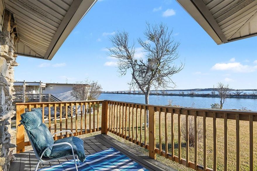 Remodeled condo in a prime top left corner location! Unit #204!  This spacious 3-bedroom, 2-bath unit features ceiling fans in every room, vinyl plank flooring in the kitchen and baths, and carpet in the living room and bedrooms. The kitchen offers granite countertops, a breakfast bar —perfect for everyday living or entertaining. Home includes a refrigerator, range, microwave, dishwasher, and stacked washer & dryer. Home is totally electric. Both bathrooms also feature granite counters. The primary suite includes a separate shower, a large walk-in closet, and a sliding door to a private deck with peaceful lake and ground views. White blinds accent every window, creating a bright, clean look. Enjoy relaxing lake views or the community pool just across the street. Close proximity to the fishing dock, beach-style swimming area, and the marina. A roomy, inviting condo in a resort-style setting on Bridgeport Lake. Bridgeport ISD. 108 Harbor Dr, #204, Runaway Bay, TX 76426.