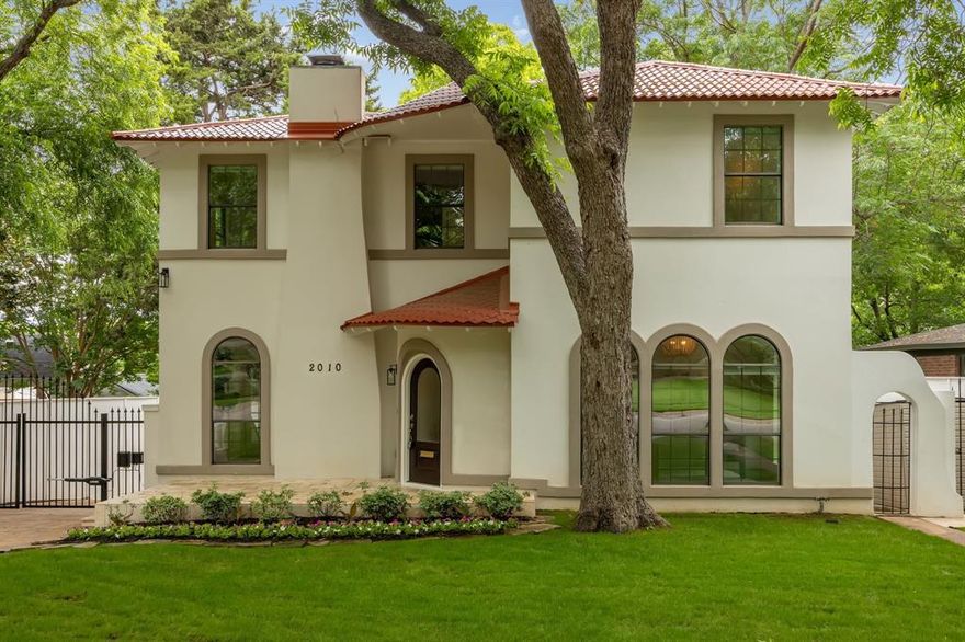 Beautifully updated 1930s Spanish Colonial in sought-after Stevens Park Estates featuring a rare 4-bed, 4-bath layout.

Timeless character meets modern living with arched windows and doorways, a coved gas fireplace, and French doors that bring in incredible natural light. The oversized downstairs bedroom—lined with five arched windows—offers the perfect flex space for a private office or guest suite, with a full bath nearby. The gourmet kitchen is equipped with stainless steel appliances, a convection double oven with microwave, and a 5-burner gas cooktop, flowing into a dramatic two-story family room with soaring windows, a built-in bar, and seamless access to the backyard.

Upstairs, the primary suite is a true retreat with vaulted ceilings, its own fireplace, a spa-like bath with soaking tub and oversized double walk-in shower, and a boutique-style closet. Two additional bedrooms each feature en-suite baths and generous storage.

The expansive backyard offers endless potential—plenty of room to entertain, relax, or add a pool. New roof and thoughtful updates throughout. Prime location near Stevens Park Golf Course, Bishop Arts District, and Downtown Dallas, with easy access to both airports. Zoned to highly desirable Rosemont Elementary School.