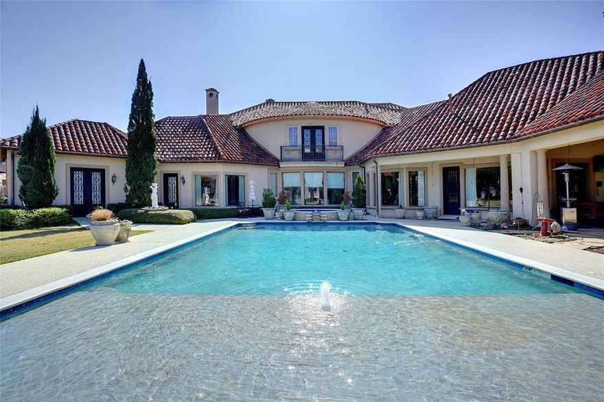 UPDATED AND STAGED MARCH 2025*INSPIRED BY THE GREAT VILLAS OF TUSCANY*APPRAISED AT $5.3 MILLION APRIL 2024*STUNNING ESTATE,LOCATED IN EXCLUSIVE GUARDED & GATED LAKE COMMUNITY OF CHATEAU DU LAC*NESTLED ON A SPRAWLING 2 ACRE LOT,CANVASSED BY MAJESTIC TREES*PRIVACY ABOUNDS*GRAND ENTRY W-ROTUNDA CEILING & HAND-PAINTED DOME*BUILT SPARING NO EXPENSE & PERFECT FOR ENTERTAINING WITH A GREAT FLOOR PLAN THAT FLOWS SEAMLESSLY*UNMATCHED ANYWHERE!*RELAX IN YOUR OWN BACKYARD PARADISE*CREATED FOR ENTERTAINING*OPENS TO SEVERAL PATIOS INCLUDING A LARGE PATIO W-OUTSIDE LIVING AREA, FIREPLACE & GRILL*BEAUTIFUL VIEWS OF EXPANSIVE POOL, BRIDGES*VINEYARD, KOI POND & FORT*NIGHT LIGHTING*STUDY W-FIREPLACE & READING AREA*WINE TASTING ROOM*SITTING AREA W-WINE STORAGE*UPPER LEVEL OFFERS 3 OVERSIZED BEDROOM EN-SUITES PLUS BILLIARDS ROOM,WET BAR & 2ND STUDY*PRIMARY & GUEST SUITE LOCATED ON 1ST LEVEL*GOURMET KITCHEN FEATURES DCS PROFESSIONAL SERIES GAS RANGE W-8 BURNERS & 2 OVENS*QUICK POSSESSION*5 HVAC ZONES*AEROBIC SEPTIC*CITY WATER*REAL STUCCO*TILE ROOF*5 TOTAL PARKING*4 OVERSIZED ATTACHED GARAGES & PORTE COCHERE*KITCHEN FEATURES SUBZERO FRIDGE, PASTA FAUCET, ISLAND, VEGGIE SINK, BUILT-IN DESK & TOP-OF-THE-LINE APPLIANCES*PRIMARY SUITE W 2-STORY CLOSET, FIREPLACE & FANTASTIC SHOWER*OTHER AMENITIES INCLUDE HAND-FORGED IRON BALUSTERS, ROJO TRAVERTINE FLOORING*3 FIREPLACES*5 FULL BATHS*2 HALF BATHS*SEE ROOM BY ROOM AMENITIES LIST, DRONE VIDEO SET TO MUSIC ON NTREIS*SEE APPRAISAL DONE BY ROBERT TOTTEN, VALUE AT $5,300.000*