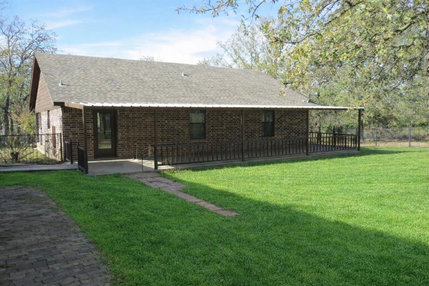 Seller is offering a $10,000 credit to buyer to use at their discretion.  Discover a secluded rural oasis in this solid brick ranch type home nestled on a sprawling, tree-lined acreage. The interior features an expansive open-concept great room with modern recessed lighting and a stunning custom-built knotty pine entertainment center. This inviting space flows into a bright dining nook and a highly efficient galley-style kitchen with abundant custom cabinetry.

The property is a true hobbyist’s dream, boasting a massive detached metal shop with partitioned storage, high ceilings, and a generous covered carport. Outdoor living is exceptional, featuring a full-length covered rear patio overlooking a level, fully fenced backyard. With secondary storage sheds and accessible ramp entry, this peaceful retreat offers versatility and comfort in a private setting.

Information deemed reliable but not guaranteed. Buyer and buyer’s agent to verify all details. Some photos have been virtually enhanced for presentation purposes.