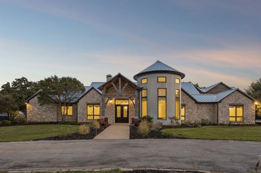 Breathtaking Estate with Equestrian Features in the Heart of DFW!
Welcome to 480 E Jeter Road, a 26-acre Bartonville estate that blends the rugged beauty of Country living with the comfort and convenience of DFW. With 12,833 sq. ft. of living space, including 9,683 sq. ft. in the main residence plus 3,150 sq. ft. in guest apartments and offices, this property offers unmatched flexibility for multigenerational living. The main residence showcases stone architecture, a standing-seam metal roof, hardwood floors, and refined finishes.
The main home features two chef’s kitchens with Miele, Sub-Zero, Wolf, and Bosch appliances, a Control4 smart system, and a primary first-floor suite with two custom bathrooms and direct pool and patio access. Upstairs, nearly 2,000 sq. ft. functions as an independent residence with gym, bedrooms, 2 full baths and full kitchen.  The private exterior entrance, or the use of the interior dedicated elevator, the ADA-accessible suite is perfect for both young and old. 
Outdoor amenities include a resort-style pool with fountains and fire features, a removable child-safety fence, and a 48 kW Generac generator with dual 1,000-gallon propane tanks powering the home for up to a week. The barn adds offices, restrooms, laundry, and a 1-bedroom apartment. Equestrian facilities include a 700 sq. ft. run-in shed, 13 stables, automatic watering stations, and an irrigated outdoor arena. The property also includes a FEMA-rated safe room, dual Brown Safe Co. safes, soft-close cabinetry, a 1.3-acre dog park with shower.
With 45,000 sq. ft. of paved parking, zoning that allows 5-acre lots, and proximity to Liberty Christian, DFW Airport, Plano, and Dallas, this estate is both a retreat and investment.
Private, luxurious, and versatile, this Bartonville estate is a rare opportunity to own a one of a kind estate in the Metroplex, where lifestyle, luxury, and location come together.