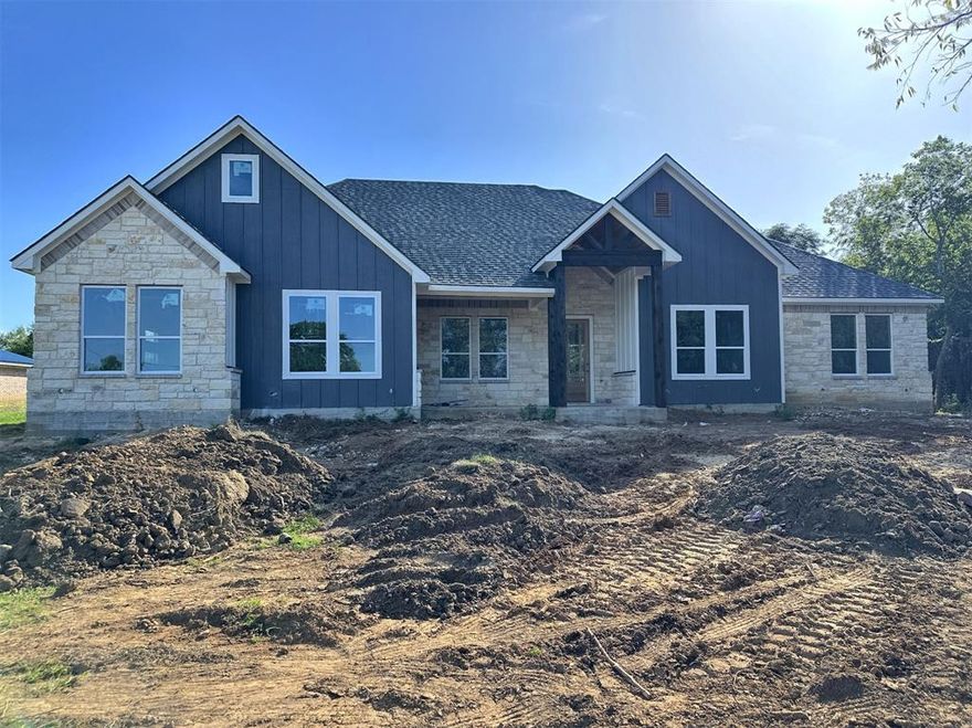 This beautiful new 4-bedroom, 3.5-bath home offers a spacious open floorplan on a .89-acre lot just outside the city limits. Inside, oak hardwood floors and large windows create a warm, light-filled living space that flows seamlessly from the living room to the kitchen and dining area
The kitchen features stainless steel appliances, ample cabinetry, and a large center island. A dedicated office provides the perfect space for working from home or managing daily tasks. The private primary suite includes an en-suite bath and walk-in closet, while three additional bedrooms offer flexibility for guests, hobbies, or family. Enjoy the peace of country living just 12 minutes from shopping and dining. This wonderful New home blends comfort, style, and space in a location you’ll love.