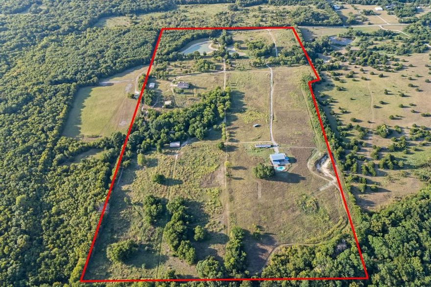 A rare opportunity to purchase 64.013 acres of land with a 2,995 square foot farmhouse, a barndominium, and a pool, all located within the Extraterritorial Jurisdiction (ETJ) of Anna, Texas, in the Blue Ridge ISD.
Spanning a substantial tract of County Road 581 frontage, this property offers excellent visibility and access for future development or immediate residential use. The gently rolling topography adds to the site’s charm and development flexibility. With essential infrastructure already in place, including water, electricity, and a septic sewer system, it is an ideal opportunity. 
This is a prime development opportunity in Anna, Collin County, TX, recognized as the 5th fastest-growing counties in the U.S. The area is experiencing significant economic and community development, including: Collin College is developing a 100-acre campus in Anna’s ETJ, enhancing educational and economic opportunities. A new $60M Downtown Master Plan includes a municipal complex with a library, as well as water wastewater upgrades and new incentives. Multiple large scale residential developments, including 9 multifamily projects under construction, are underway. Projects like Liberty Hills (1,000 acres mixed use) and Rockhill Development (128 acres residential) are shaping the future of the community. The city boasts a pro business, pro development City Council with a streamlined permitting process.
Benefiting from strategic access to State Highway 121, this property is near leading regional amenities, high-growth residential communities, and regional catalysts like G2 Motorsports Park, HEB, Bucee's, Kroger, and Walmart. The site is only a few miles from the Collin County Outer Loop, a major infrastructure project slated to connect Anna to the Dallas North Tollway by Q2 2026. This is a rare chance to secure land in a growing corridor poised for long-term appreciation.
