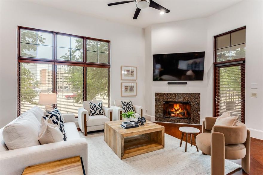 Set in a premier location, this exclusive residence offers effortless access to Downtown Fort Worth, Trinity Trails, Bass Hall, Sundance Square, and more of Fort Worth's most vibrant dining and entertainment destinations—all just moments away. This newly renovated condo in Downtown Fort Worth, which is located on a quiet street just steps from City Center, offers the convenience to downtown but the feeling of a peaceful getaway. Recently renovated with luxury finishes, rift cut white oak cabinets, Taj Mahal quartzite and solid brass hardware that grace the primary bath, secondary bath and laundry room, along with a fresh coat of paint throughout. Designed for a true lock-and-leave lifestyle, this boutique building features only nine private residences, ensuring both privacy and sophistication. Enjoy secure, gated parking with two reserved spaces and access to a private fitness center.
Inside, the home is defined by soaring 12-foot ceilings, expansive open living spaces, and 8-foot doors throughout. Floor-to-ceiling windows flood the interiors with natural light, complementing the sleek polished concrete floors and custom finishes. The thoughtfully designed two-bedroom layout includes a spacious primary suite with dual vanities, a jetted soaking tub, and a separate glass-enclosed steam shower. The chef’s kitchen is both functional and elegant, featuring a gas cooktop, generous prep space, and a seamless flow into the main living areas.
Additional highlights include a gas fireplace, abundant storage, a dedicated laundry room with built-in cabinetry, and not one—but two—private balconies for elevated indoor-outdoor living. The closets and additional storage space make this even more special. This condo is unique in a number of ways and is a must see. Current owner has installed new HVAC, water heaters and disposal in addition to the renovation. Schedule your tour today and experience Downtown living at its very finest!
