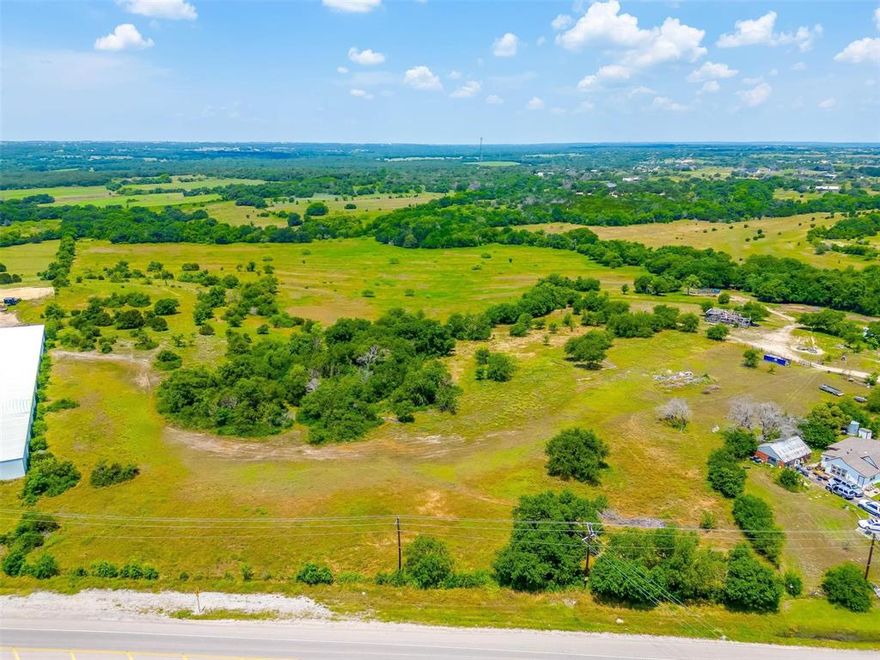 MULTIPLE OPPORTUNITIES for the buyer of this 124+- ACRES just outside of the Weatherford City Limits and ETJ. With 388 FT of FM 51 FRONTAGE and only 2.8 miles from the new Ric Williamson Memorial Loop, this property offers options for RESIDENTIAL, COMMERCIAL, or RANCH development. A RARE OPPORTUNITY as this property has belonged to the same family since the 1930's! Land is Ag Exempt. Great Elevated Views, Beautiful Hardwoods, Open Pasture, Seasonal Creeks, Wildlife, No City Taxes, Close to the City but still in the Country! COME TOUR THIS PROPERTY!