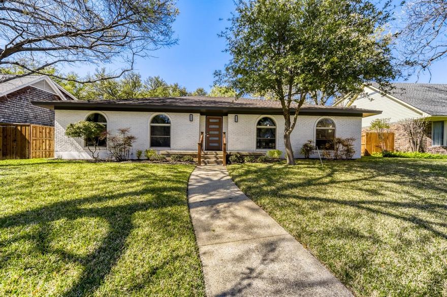 Custom single-story home situated on a nearly quarter-acre lot with beautiful mature trees in a highly desirable Far North Dallas neighborhood. This property offers easy access to top-rated private schools and is within the sought-after Richardson Independent School District. The home features an excellent floor plan with three large living areas. The spacious primary suite includes an en suite bath with an updated toilet and shower, complemented by large secondary bedrooms and a guest bath with a walk-in tub. The expansive family room boasts original hardwoods, a vaulted ceiling with exposed beams, and a curved brick wall with a gas fireplace. Additionally, the property includes a large, climate-controlled enclosed patio and an oversized garage. With ample storage throughout—including built-in drawers, shelving, and spacious closets—this is a fantastic opportunity to own a home in one of Dallas's most coveted neighborhoods at a great price.