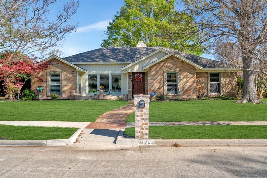 Elegantly updated single-story ranch home in Plano's popular Woodhaven neighborhood. The current owner has seen to many new details! the front bistro-sized patio slab was added and is just one of the outdoor living areas. There's also a lovely pergola in the back yard area. Coffered ceilings in the living spaces are timelessly chic. New white oak flooring, new Pella windows, new shutters. Quartz countertops were added in kitchen with designer pendant light over island and cabinets were updated. Light fixtures have been upgraded in many locations in the home. The spacious primary bedroom with ensuite bath features a seamless glass shower, new soaking tub, quartz countertops and large walk-in closet. Secondary bedrooms are also generous in size and one has a walk-in closet. Neighborhood borders Big Lake with beautiful walking trail and home is located in highly rated school district. Refrigerator, washer and dryer to convey. Multiple offers received.