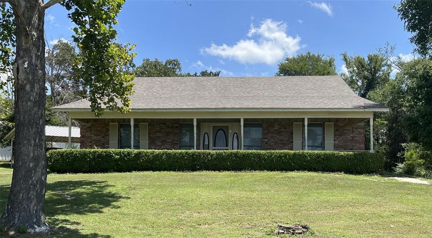 Very nice corner lot  with home that sits on 9.979 acres.  Property has a barn-workshop with a separate area that has an air conditioner for work space, a small grove of peach trees and blackberry vines that still produce, a well house that has been piped to use in the back yard, main water is thru Myrtle Springs Water Co, large floored attic space with pull down ladder, the pasture had been cut for hay in the past. Lots and lots of big trees.  Home sits off the road approximately 300-400 feet. Very private.