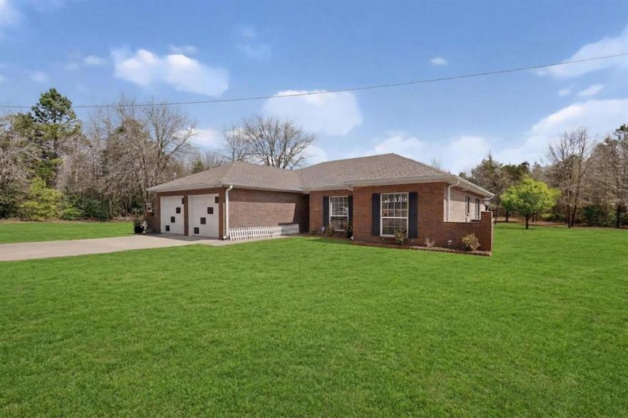 Escape to peaceful East Texas living on approximately 2.9 acres with this well-maintained 3-bedroom, 2-bath home built in 2004. Surrounded by mature trees and set back from the road, this private rural property offers open land, no HOA, and room for a shop, animals, gardening, or outdoor recreation.

Interior features include custom cabinetry, crown molding, wood-look flooring, spacious living area, and a cozy wood-burning fireplace. The kitchen offers ample counter space, breakfast nook, and appliances that convey. The primary suite features a jacuzzi tub and separate shower. Major updates include a roof and HVAC approximately 2 years old.

Outdoor highlights include a large driveway with additional concrete parking, covered back patio with electrical access, and insulated two-car garage with custom storage. Property is septic serviced with access to city water via easement. Ideal for buyers seeking acreage, privacy, country lifestyle, homestead potential, or investment opportunity with convenient access to Tyler, Gilmer, and Kilgore.

Agents: SEE PRIVATE REMARKS - all offers are subject to lender approval. This Property is a reverse mortgage.