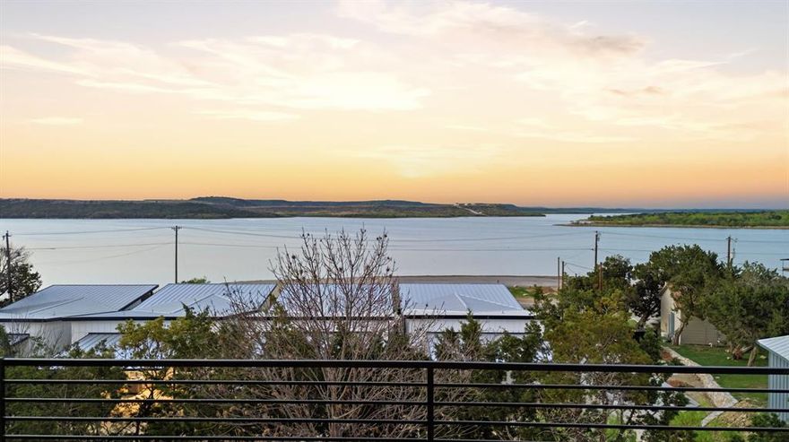 Experience elevated lake living in this stunning new construction overlooking the iconic waters of Possum Kingdom Lake. Perfectly positioned on the peninsula, this property offers sweeping, unobstructed views and unbeatable convenience with direct access to local dining, shopping, and entertainment.

Designed with both relaxation and investment potential in mind, this 3-bedroom, 2.5-bath home features a modern, open-concept layout ideal for hosting and entertaining. Expansive windows invite in natural light while showcasing the breathtaking lake views from the main living spaces.

Enjoy resort-style amenities including a pool overlooking the lake, perfect for unwinding after a day on the water. With a boat ramp just across the street, lake access is effortless, making every day feel like a vacation.

Short-term rental friendly, this property presents an exceptional opportunity for both personal enjoyment and income potential. Whether you're searching for a weekend retreat or a high-performing investment, this is lake living at its finest.