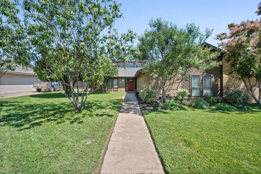 Welcome to 1023 Auburn Drive in Arlington, Texas—an updated 4-bedroom, 2.5-bath home offering approximately 2,210 square feet of functional living space on a spacious 9,278 square foot lot.

This property features a well-designed layout with multiple living and dining areas, creating flexibility for everyday living, entertaining, or work-from-home needs. The kitchen includes granite countertops, deep sink, pantry storage, double-wide drawers, and a smart stove with built-in air fryer. Adjacent laundry area offers built-in cabinetry, a half bath, and direct access to the garage, which also includes additional storage cabinets.

Interior highlights include a double-sided fireplace, abundant natural light, self-retracting blinds, and motion-sensor hallway lighting. The primary suite includes dual closets and a double-sink vanity. A secondary bedroom features a walk-in closet, and a mounted TV in one of the additional rooms will convey with the property.

Recent updates include improved ventilation, a central HVAC system (approximately 5 years old), and a full security alarm system. Additional features include a smart garage door opener, multiple storage closets, and built-in cabinetry throughout.

The backyard is designed for outdoor enjoyment, featuring a heated pool, extended side driveway with space for additional parking (such as recreational vehicles, trailers, or boats), and a privacy fence. Landscaping incorporates Texas-native plants, and the yard is supported by a French drain system and smart irrigation for efficient maintenance.

Conveniently located with access to major highways, shopping, and recreational areas, this home offers a combination of indoor comfort and outdoor functionality. A nearby utility substation is present in the area.

If you're looking for a well-maintained Arlington home with a pool, flexible living space, and practical upgrades, 1023 Auburn Drive is a strong opportunity to consider.