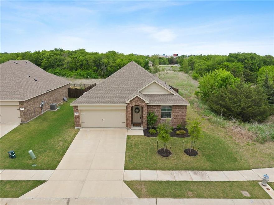**Charming Retreat on Quiet Cul-de-sac**

Discover your dream home nestled in the serene community of Fate, TX. This beautifully crafted 4-bedroom, 2-bathroom residence boasts a 2-car garage and is perfectly positioned on a cul-de-sac lot with no homes directly behind or to one side, offering ultimate privacy and tranquility.

Step inside this light-filled home, where an open-concept design seamlessly blends living spaces while providing a cozy and inviting atmosphere. The spacious living room flows effortlessly into the dining and kitchen areas, creating an ideal setting for entertaining or simply enjoying everyday life. Large windows throughout ensure abundant natural light, emphasizing the home's bright and airy ambiance.

The heart of the home is the stunning kitchen, featuring crisp white cabinetry and ample counter space that will delight any culinary enthusiast. Designed to accommodate both casual meals and formal gatherings, the kitchen's functional layout offers plenty of room for cooking and entertaining.

The primary suite is a peaceful retreat, offering a generously sized bedroom and an ensuite bathroom complete with double vanity and ample storage. The additional three bedrooms are versatile and spacious, perfect for guests or a home office, and all have walk-in closets.

Outside, enjoy the serenity of your extended patio with a charming gazebo, perfect for relaxing or hosting outdoor events. The backyard faces a greenbelt, ensuring a peaceful escape from the hustle and bustle of daily life. With such an idyllic backdrop, your outdoor oasis is ideal for savoring the Texas evenings.

This brick home offers a rare blend of privacy, comfort, and natural beauty. Enjoy all the amenities and charm Fate has to offer, while also relishing the seclusion and peace this unique property provides. Experience the perfect harmony of style and functionality in this elegant sanctuary.