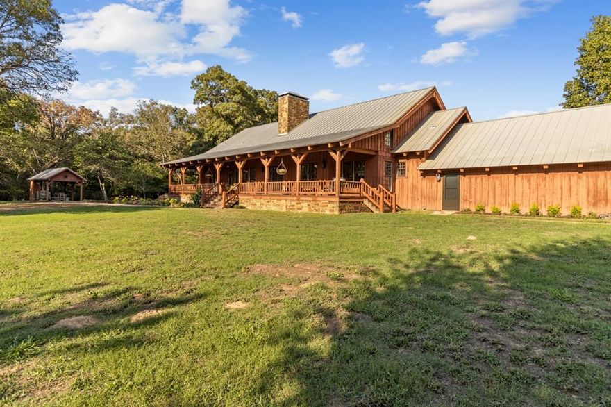 Stunning home on 197 acres of beautiful Southeast Texas land, the possibilities are endless.  A perfect place to hunt, fish, raise cattle, and escape the hustle of life.  The property encompasses two ponds, a barn, corrals, a workshop, pole shed, cattle pens, and a water well.  Dove Ridge offers a true cattleman’s delight with fenced and cross fenced pastures that are great for hay production. The property has the perfect mix of timber and open pasture. This 3417 sq ft custom built home boasts of a relaxing full-length front and back porch, great for watching the deer and other wildlife. The impressive floor to ceiling two-sided stone fireplace separates the kitchen from the spacious family room.  Heart of the Pine solid wood floors and pine cabinets throughout all the main living areas. Enjoy the oversized walk out attic for an abundance of storage or be creative and add an additional bedroom or bonus room. Don’t miss your opportunity, call today for your private tour!