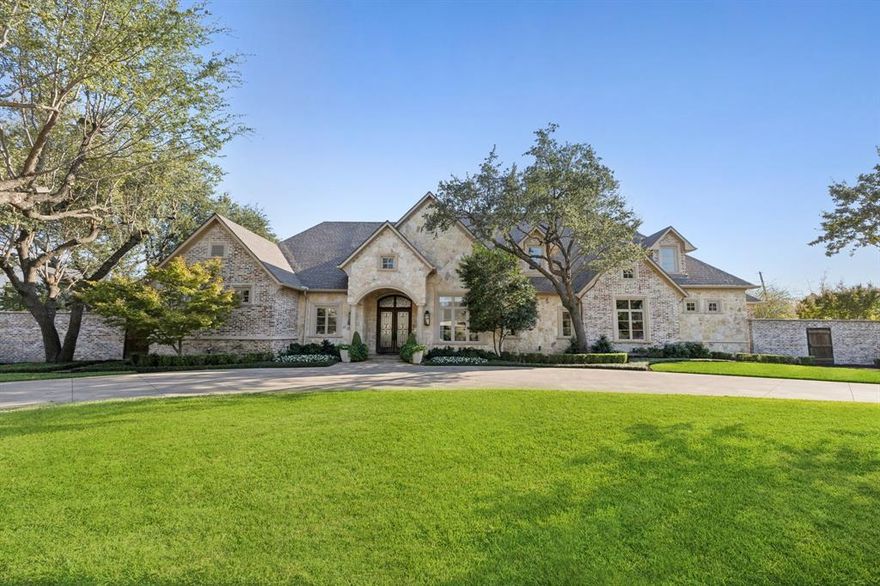 Welcome to this stately transitional residence in the prestigious Preston Hollow enclave. Built in 2006 and thoughtfully updated in 2015, 2022 and 2024. 4 bdrms, 3.1 ba, 5,102 sqft of luxurious living space on a sprawling .514 acre lot. Step inside to discover elegant formal sitting and dining room with open floor concept living. Culinary kitchen with marble counter tops & butcher block end, center island, built-in Thermador range, custom double refrigerator with four freezer drawers opens to breakfast rm, spacious living rm, and wet bar w built-in wine refrigerator & ice maker. Living rm w gas FP, overlooks back covered patio & pool. The first-floor primary suite offers sitting area, gas FP, French doors to covered patio, and luxurious bathroom w sep vanities, garden tub, sep shower and large walk-in closet. First floor is complete with a home gym, large cedar closet, study or versatile fourth bdrm and spacious utility rm. Upstairs, retreat to a media room w wet bar and sink, two bedrooms and utility closet. Backyard oasis features 1400+sqft of covered outdoor living with large kitchen island for seating and prep and storage space, built-in grill, living and dining area with four electronic screens, saltwater pool & large turfed yard. Attached 3-car garage with epoxy flooring, sink, built-ins and large walk-in closet for ample storage space. Complete with a full house Generac generator.