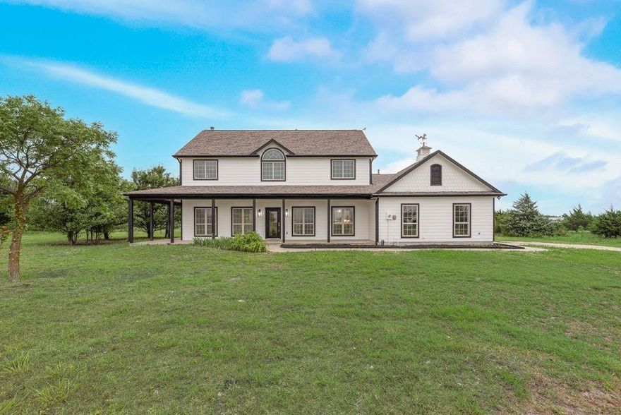 Beautifully updated 5-bedroom country retreat on 3.8 acres in McKinney ISD! This nearly 3,000 sq ft home features hardwood floors, a renovated kitchen with granite countertops and gas range, fresh interior and exterior paint, updated lighting, resurfaced wood flooring, and an expansive wrap-around porch. Flexible living spaces offer room for a home office, game room, or guest suite. Enjoy peaceful country living with room for horses, a pool, workshop, or garden — all just minutes from shopping, dining, and city conveniences. Additional features include a built-in storm shelter, central vacuum system, fenced backyard, and mature trees for added privacy. Book a showing today!