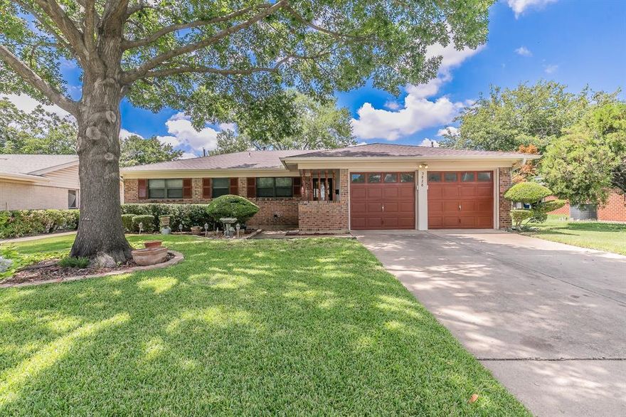 This beautifully maintained South Fort Worth home is the perfect blend of comfort, style, and functionality, making it an exceptional starter home with features you’ll fall in love with from the moment you walk in. The open floorplan creates an inviting flow, starting with a super-large living room anchored by a charming brick fireplace, seamlessly connecting to a well-appointed kitchen plumbed for gas and offering abundant workspace for cooking and entertaining. A separate laundry room with cabinetry provides excellent storage and includes a washer and dryer that convey. Stunning Saltillo tile runs throughout the main living area and kitchen, adding warmth, durability, and timeless character. The thoughtfully designed layout offers spacious bedrooms and a true dream primary suite with an impressive 11-by-12-foot closet and a private bathroom that opens directly to your own backyard oasis featuring a luxurious hot tub spa that conveys. The backyard is a showstopper, boasting stunning mature landscaping, an expansive covered patio perfect for entertaining, and plenty of grassy space for activities. A massive shed offers endless possibilities as a workshop, while an additional large covered space provides the ideal spot for hobbies, storage, or creative projects. With its charming finishes, exceptional outdoor amenities, and move-in-ready appeal, this home offers a rare combination of everyday comfort and unique extras that are hard to find in this price range. Brand new roof and gutters summer 2025!!