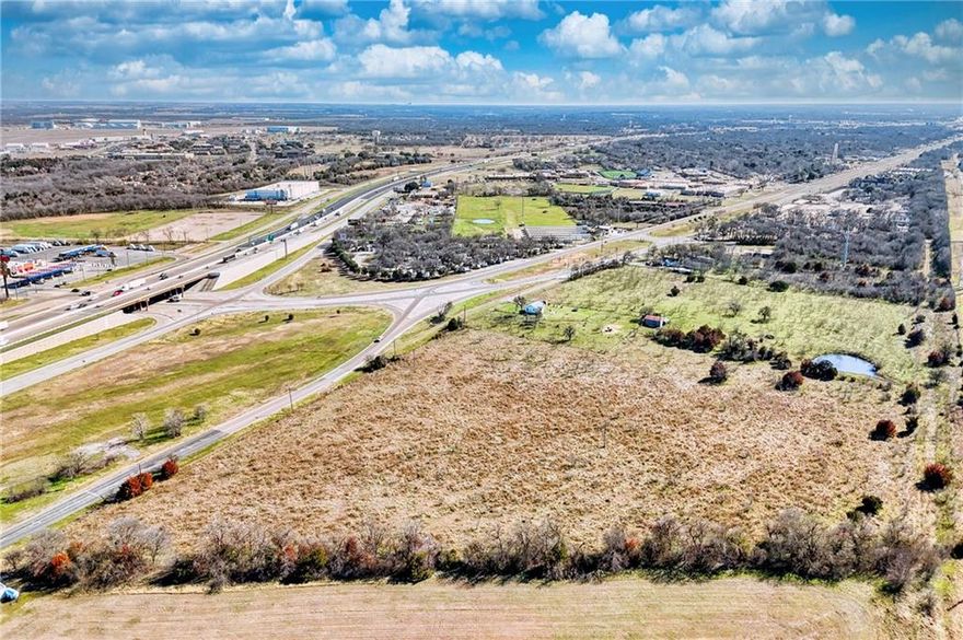 Owner financing available!  Discover the unlimited potential of this 33.96-acre property - a blank canvas awaiting your vision in the Greater Waco area.  Zoned C-2 (community commercial district), this property provides an extremely wide range of development options.  The location is prime - less than ten minutes into the heart of Waco (Baylor University and Magnolia Silos) and conveniently located on Old Dallas Road/Hwy Business 77 right after you exit I-35 (also accessible from Spring Lake Road).  Governed by the city of Lacy Lakeview, business owners are supported and encouraged by a “pro-business” council.  In close proximity to an array of businesses, RV parks, Connally ISD, and Texas State Technical College – this is the place to turn your blueprint into reality.  There is an existing home on the property.  The property is fully fenced with a pond, an old barn, is ag exempt and is currently being grazed by cattle.  Your opportunity awaits!