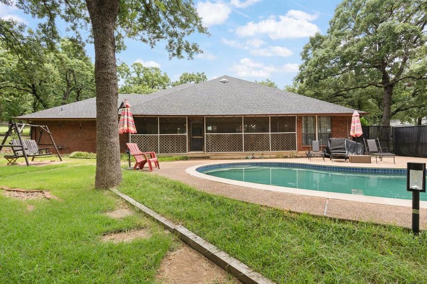 Lovely home on .79-acre lot with many oak trees. This home has many recent updates: roof June 2025, HVAC and ductwork, aerobic septic system, fantastic master bath with deep free standing tub and large walk-in shower, large open living & dining area, screened in back porch with view of play pool and lots of decking, garage is over sized side entry with extra parking for RV, boat, etc.,  the lot past driveway extends well beyond fence line ideal for garden area, play area, or ? Property located less than 5 miles to I35. Close to shopping and restaurants. Pool cover and 1 year old refrigerator will remain. Seller offering $10,000 closing concessions.