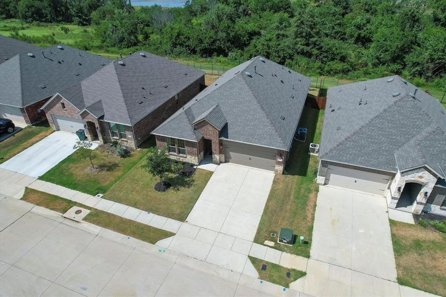 NEW PRICE on this EXCLUSIVE PEACEFUL & PRIVATE GREENBELT LOT in beautiful Silverado - there are no future new home sites available on these incredible park-like lots. Why wait 3-4 months for new construction when your like-new home is ready for immediate move-in? The discontinued Zinnia floorplan with 4 bdrms, 3 full baths, PLUS a study and full sized dining room includes impressive upgrades of 42 inch kitchen cabinets, gas log FIREPLACE, ceiling fans in all bdrms and rich, flowing durable wood look tile. Fantastic open concept with soaring 10 ft ceilings and abundant natural light.  Dream kitchen with gas, quartz & walk-in pantry. Master bath features massive shower, walk-in closet & 2 sinks. Incredible amenities including 2 additional pools currently under construction. Zoned for new West Elementary.