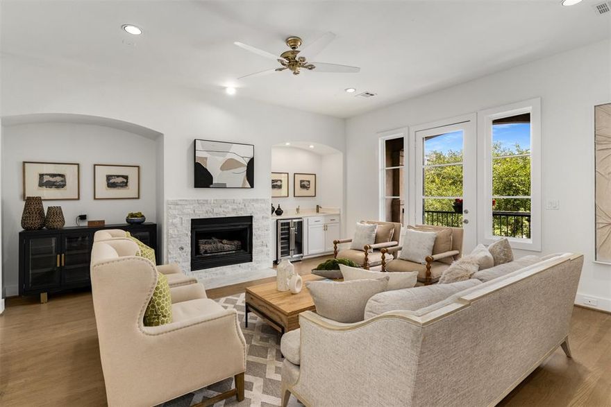 Beautiful Completely Updated Brownstone style TRUE Townhouse with NO HOA. Priced below comps in the immediate Oak Lawn area and in same town home row! Walkscore.com gives this address a 95, calling it a Walkers Paradise!! 6 blocks to Highland Park, Only 4 blocks to Katy Trail, Uptown and Turtle Creek! Home has 3 balcony's, a private front fenced yard and a covered gated patio off of office for your pup to lay and chill. Downtown views from the East side patios and windows. Large Open Living, Dining and Kitchen. Kitchen has gas cook top, large island, walk in pantry and a new fridge!  Living and dining on second level have balconies, New wine cooler in wet bar and a fireplace in living. Fireplace also in primary Bedroom and bathroom! Bedrooms are on split levels. First floor has 2 car garage, office space, storage, 2nd bedroom with en suite bath and closet. Spacious Primary suite on the 3rd floor has a double sided fireplace which faces both the bath and bedroom, laundry by the huge over sized walk in closet, Large walk in separate shower, freestanding bath tub, double sinks and a sky light! New Energy efficient Tankless hot water heater! BUYERS! When buying a town home you get the same interest rate on a mortgage as a single family home, Unlike a condo style townhouse which has a higher rate! Please see video in Media link! Visitor parking between Lucky's and the Town home subdivision. If buyer does not prefer the gold accents, they can be switched to silver.