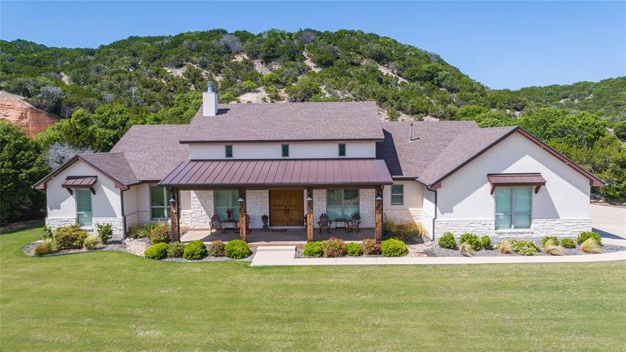 Come home to this stunning executive residence built by Scott Olson Homes, perfectly tucked away in the secluded Sandstone community. From the inviting front porch, enjoy breathtaking views and a peaceful setting that feels like a private retreat. This thoughtfully designed home offers 4 bedrooms, 3.5 bathrooms, a spacious living room with a cozy fireplace, and an additional family room ideal for a home office or flexible living space. The dream kitchen is a true showstopper, featuring a 5-burner gas range, granite countertops, a charming coffee nook, and a large island perfect for cooking and gathering. The oversized pantry provides exceptional storage with abundant outlets—even in the floor—for ultimate convenience.  
Throughout the home, you’ll find elegant plantation shutters and generously sized living spaces, including an expansive primary suite designed for comfort and relaxation. The oversized 3-car garage and extended driveway offer ample space for vehicles and guests alike.  
Step outside to your private backyard oasis, complete with a beautiful pool, large covered patio, and outdoor fireplace—perfect for entertaining or unwinding in serene surroundings.  It's also plumbed for a gas BBQ grill. This home is as practical as it is luxurious, featuring a whole-home Generac generator with automatic transfer switch, two HVAC units, and two water heaters. Even better, the kitchen refrigerator, washer, and dryer convey with the sale.  Located in the highly regarded Jim Ned School District, this exceptional property truly has it all. A must-see to fully appreciate its quality, comfort, and lifestyle.
