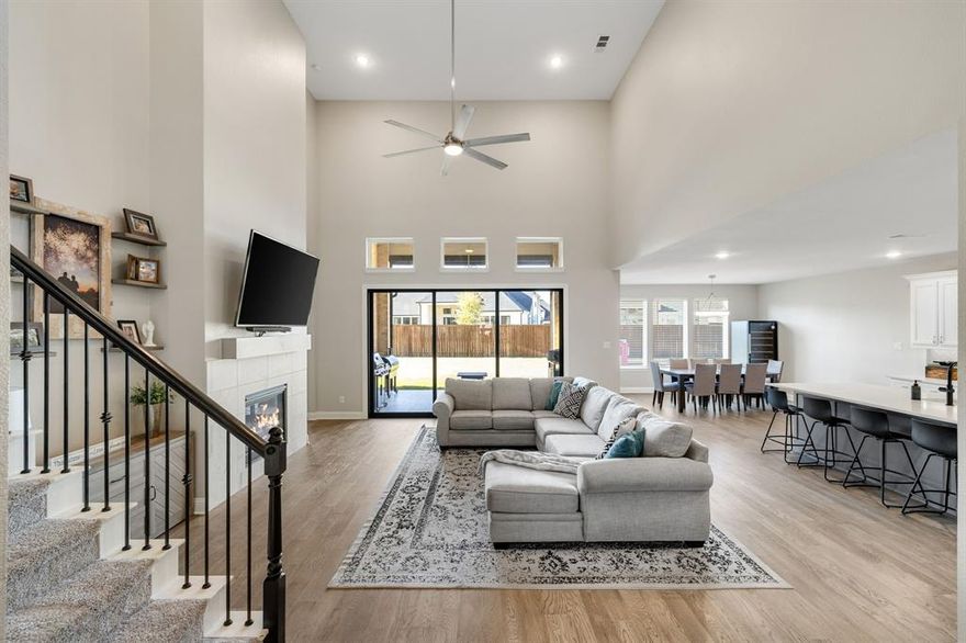 Completed in 2023, this beautifully updated Toll Brothers home offers 4 bedrooms, 3.5 baths, and a 3-car garage, blending modern comfort with timeless style on a serene .3-acre interior cul-de-sac lot. Upgraded lighting and fresh interior paint set a warm, welcoming tone throughout, while new wood flooring on the first level and new oven, microwave, and dishwasher add thoughtful convenience. At the front of the home, a private office provides a quiet place to work or study, and a spacious secondary bedroom with walk-in closet and ensuite bath creates an ideal setup for guests or multigenerational living. Tucked at the back, the private Owner’s Retreat features a tray ceiling along with a spa-inspired bath that includes dual vanities, a soaking tub, oversized shower, and generous walk-in closet. The bright, open living area is the heart of the home, boasting a wall of windows overlooking the expansive backyard, a cozy fireplace, and seamless flow into the kitchen and dining space. The well-appointed kitchen delights with a gas cooktop, vented exhaust fan, double ovens, Black Python granite counters, under-cabinet lighting, a large island, and a new sink with touch faucet. Upstairs, two additional bedrooms—each with a walk-in closet—are joined by a media room, game room, and a full bath, offering wonderful flexibility for entertainment, creativity, or quiet retreat. Outside, an oversized tiled patio with a motorized screen invites year-round relaxation and outdoor dining, overlooking a pool-sized yard with lush grass and a storage shed. Just down the street, the community’s lazy river and playground await, and residents also enjoy a resort-style pool, clubhouse, over four miles of trails, parks, and fields of seasonal wildflowers—plus the convenience of an on-site elementary school. A home like this pairs everyday luxury with an unbeatable lifestyle, making it a place you’ll love coming home to.