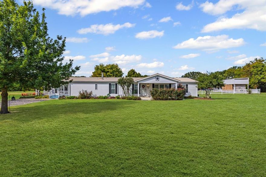 This beautiful, multigenerational property is a must see!! This beautifully maintained double wide mobile home boasts a 1bd 1ba and 3bd 2ba side with plenty of storage space. That is everything you need for your in-laws, college kiddo or best friend to live under one roof with their own living space! This property sits on a well manicured and landscaped 11.88ac of mostly Bermuda Grass. It also has a quarter acre pond with it's own island with year round geese and blue and white crane birds. The pond is also stocked with bass, crappie, blue gill and catfish. This awesome property has a covered RV spot with hookups for electricity, water and septic. There is also a 60x60 work shop at the back of the property with electricity and water with a huge carport big enough for another RV and a few vehicles. This property is 1 mile to Sand Hills Golf and Country Club, 4.2 miles to Walmart Super Center, 4.4 miles to Texas A&M Commerce and other Commerce shopping! If growing your own vegetables is appealing, there is a large garden with irrigation from the pond when the season is dry. The unused part of the property serves as the agricultural aspect that is coastal hay producing. The possibilities with this property are endless! All measurements are to be verified with buyers agent and buyer