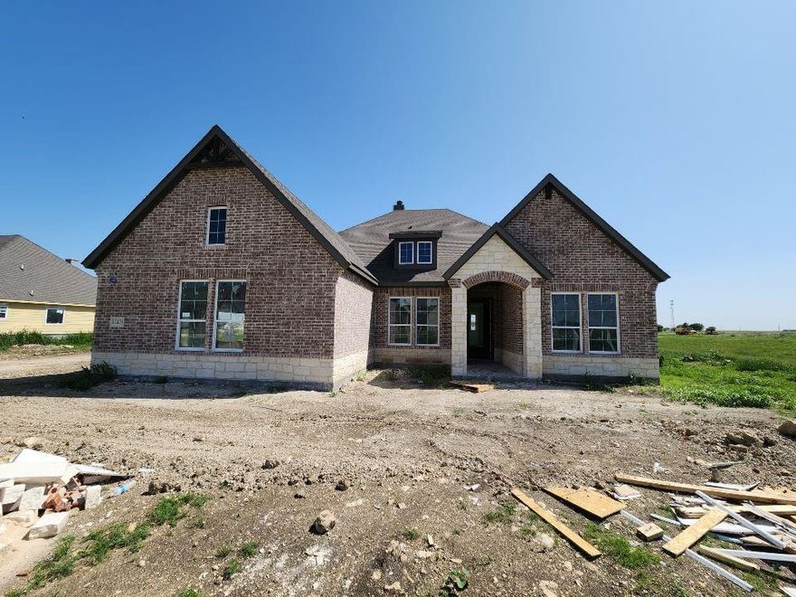 Estimated June 2026 completion! Ask us about our Trade In Trade Up program, we can buy your home! The Verbena floor plan features a modern, open-concept layout and the sought-after features today’s homeowners are searching for. With four bedrooms, three bathrooms, and a flex room, this plan boasts just over 2,400 square feet of functional living space. Upon entering the home off the front porch, you’re welcomed by an inviting foyer. Immediately to the left is a hallway with a bedroom, walk-in closet and full bathroom, as well as a linen closet. Across the foyer is a flex room, perfect for a home office, formal dining room or whatever need your family has for the space. Past the foyer is the family entry, with storage space and mud bench, which leads to the laundry room and two or three car attached garage. Through the entrance, the home opens up to a large family room with a stately fireplace. Adjacent to the family room is a gourmet kitchen, equipped with a walk-in pantry, ample counter space and an oversized island. Finishing off this open-concept living area is a dining space which overlooks the covered back patio. The remainder of this one-story floor plan is just off the living space. A hall leads to two bedrooms with walk-in closets, another linen closet and a shared full bathroom. The back corner of the home offers privacy for the owner’s suite, featuring a massive walk-in closet and bathroom with a dual-sink vanity, standalone soaking tub and glass-enclosed shower.
