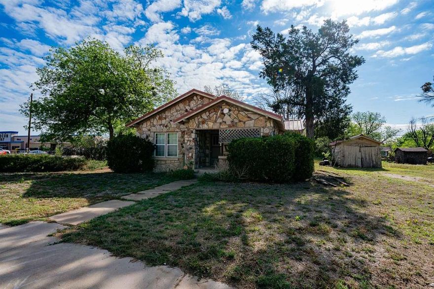 This cozy 1940s rock home is full of character, boasting original hardwood floors, classic craftsmanship, and a charming clawfoot tub. The home includes 2 bedrooms, 1 bath, a handy basement, a covered back porch, and a storage building for all your extra needs. Centrally located in the heart of Haskell, this property offers great small-town living. Sitting on a corner lot with an additional lot, mature pecan trees, and your own water well, this home combines vintage charm with plenty of space to enjoy and make your own.