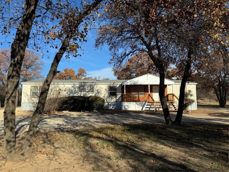 Oak filled Acre lot with not one But TWO double wide mobile homes making the possibilities endless!  First home is 4 bedroom and 2 baths, second home is 3 bedroom and 2 bath with an open concept.  Beautifully updated with interior and exterior paint, stained porches, and HVAC in the larger home for peace of mind.  Work continues on both homes but should be finished December 17th and fresh photos of this great property will follow.