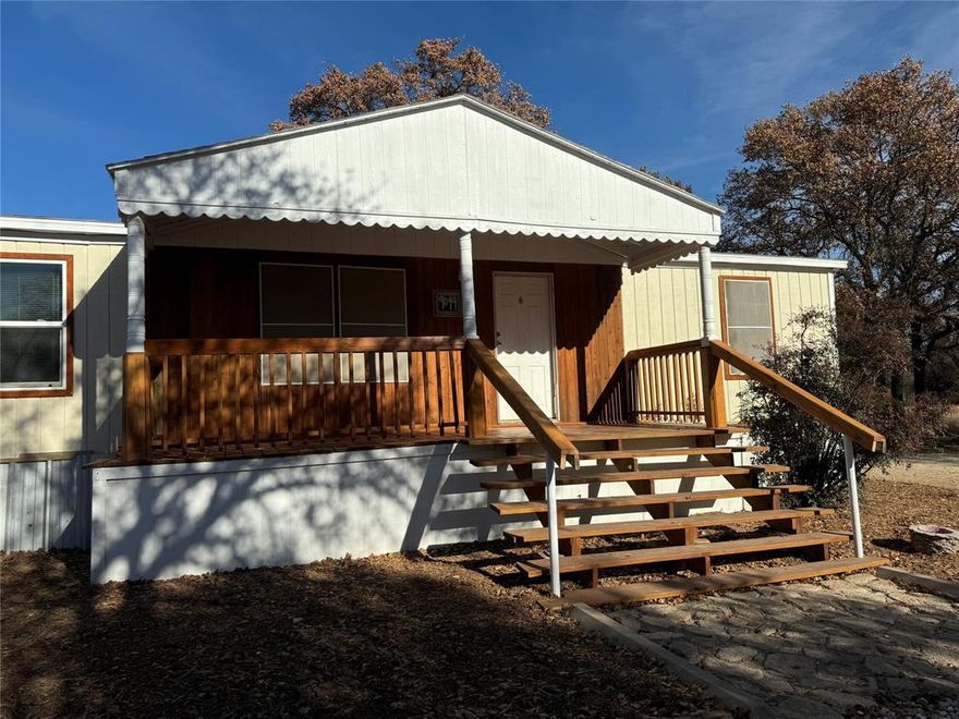 Oak filled one Acre lot with not one But TWO double wide mobile homes making the possibilities endless!  First home is 4 bedroom and 2 baths with an office and second home is 3 bedroom and 2 baths with an open concept.  Both Beautifully updated with interior and exterior paint, newly constructed and stained porches, and new HVAC in the larger home.  Outside, you will have So Many options to enjoy the views from the Decks and porches including an expansive screened in porch.  This is the perfect opportunity for a smart buyer to live in one home while generating income by renting out the second home.  Or if you are looking for a multi-generational set up this is IT!