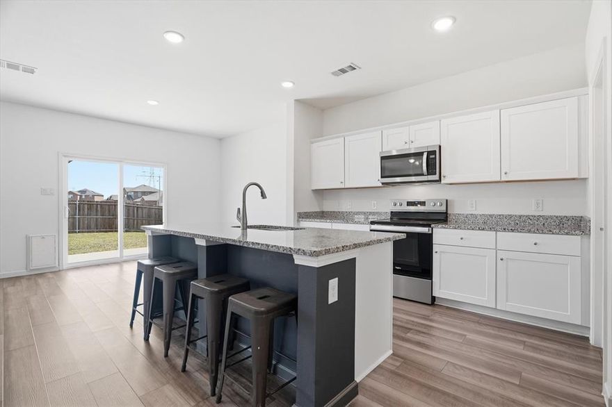 Situated on a desirable corner lot, this beautifully maintained home offers a functional layout, modern updates, and plenty of space for everyday living and entertaining. The open-concept floor plan creates a seamless flow between the main living areas, making it perfect for gatherings or relaxing at home. The updated kitchen is a standout feature, complete with stylish shaker-style cabinetry, granite countertops, stainless steel appliances, and a large island that provides additional prep space and seating. A spacious walk-in pantry ensures ample storage and organization for all your kitchen essentials. Luxury vinyl plank (LVP) flooring runs throughout the kitchen, hallways, pantry, and bathrooms, offering both durability and a cohesive, modern look. Dedicated downstairs home office—ideal for remote work, studying, or a quiet retreat. Upstairs, a versatile second living area or game room provides additional space for entertainment, hobbies, or a media setup. The conveniently located upstairs laundry room adds ease to your daily routine. Step outside to a generously sized backyard with endless possibilities. Whether you envision hosting summer barbecues, creating a play area, or adding a pool, this outdoor space is ready to accommodate your lifestyle. Located in the lovely Panther Heights community in Fort Worth, this home offers easy access to major highways, making commuting a breeze. You’ll also enjoy being just minutes from a variety of shopping, dining, and entertainment options. This home combines comfort, style, and convenience—don’t miss your opportunity to make it yours!