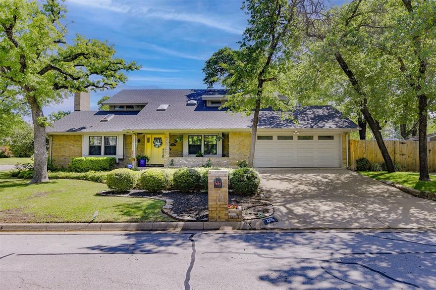 OPEN HOUSE THIS SAT May 9th 2-4pm.  This stunning, four-bedroom Arlington home showcases impressive updates and sits on a desirable corner lot framed by manicured foliage, majestic oak trees and multiple inviting patio places prefect for outdoor living.  This home's expansively designed layout unfolds with a graceful open flow, connecting generous living areas.  Each space transitions effortlessly into the next, creating an ideal setting for hosting large gatherings while still offering an inviting, comfortable retreat perfectly suited for relaxed everyday family living.  Fun, private English-styled library, complete with rolling ladder and cozy fireplace, is the perfect place to enjoy the latest page turner.  The stylish, show-stopping gourmet kitchen was completely reimagined a few short months ago, thoughtfully rebuilt with exceptional attention to detail.  Rich butcher block countertops add warmth and character while providing generous prep space sure to impress even the most discerning chef.  Seamlessly opening into the informal living area inviting connection and conversation, this will be the heart of your home.  Principal suite boasts of French door leading to private balcony, plus sumptuous bath with flexible room for workout area, private office or additional closet or dressing area...you choose.  Privately positioned on the first floor, the split bedroom enjoys direct access to a full bath creating a versatile retreat.  Tucked away from the main living areas, it offers just the right amount of privacy for overnight guests, older children or aging parents.  This quiet location also transitions beautifully into a home office.  Don't miss the additional parking for a third car, boat or RV.   Be sure to review the lengthy list of updates and improvements.  Thoughtfully enhanced and meticulously maintained, this home is truly in move-in condition, allowing you to settle in an enjoy from day one.