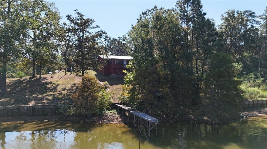 Ready to fine your spot on the lake? This little gem just needs a little polish to became a great home or weekend getaway. The porch has a great view of the lake where you can sit and sip your coffee in the morning. This small home has huge windows that make it feel larger and bring you closer to the lake.

All measurements should be verified by buyer.