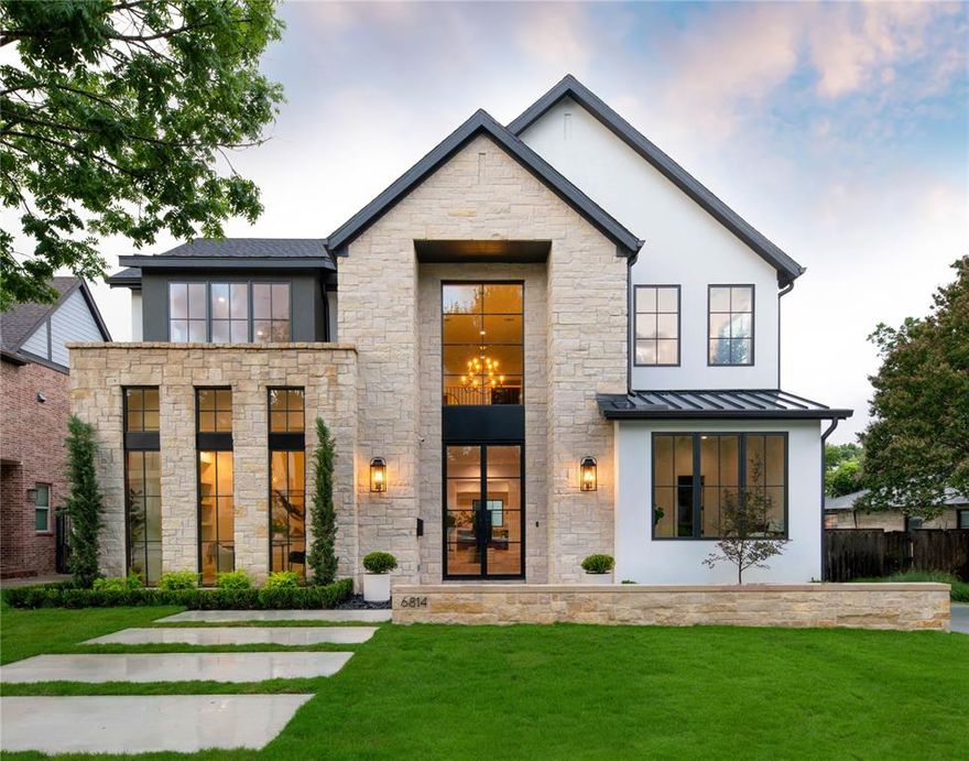 This stunning new construction by Stainback Construction is a bespoke Lakewood residence showcasing timeless architecture and modern amenities—highlighted by a 559-square-foot fully plumbed back house not included in the main home's square footage. Situated on a .23-acre lot, the home’s design reflects thoughtful craftsmanship and elevated livability at every turn. At the center of the home is an exceptional eat-in kitchen, featuring a Wolf commercial range, built-in SubZero refrigerator, and ice maker. A fully outfitted butler’s pantry complements the space with a built-in Miele coffee maker, Wolf microwave and wine fridge—ideal for entertaining. Throughout the home, custom White Oak inset cabinetry with soft-close functionality pairs beautifully with designer lighting and premium finishes. Every detail speaks to quality: 9” wide-plank hardwood floors, Pella windows and doors, and the Brilliant Smart Home System offering effortless control of lighting, speakers, thermostats, and window shades. The primary suite is a luxurious retreat with electric window shades, dual vanities, a soaking tub, a 100-square-foot stand-alone shower, heated floors and two private water closets outfitted with Neorest Toto Bidet toilets. A California Closets system completes the expansive custom walk-in closet. Additional features include a downstairs study with built-in cabinetry, an upstairs family room with wet bar and beverage fridge, and a dedicated workout room that can work as a 5th bedroom. Step outside to a large, fully turfed backyard with a sprinkler system, board-on-board privacy fence, and a covered patio with a ceiling fan, ideal for year-round enjoyment. Enjoy the oversized two-car garage with epoxy flooring and custom cabinetry, as well as the upstairs back house offering a bonus bedroom, half bath and mini kitchen. Zoned to Lakewood Elementary, this one-of-a-kind property offers a rare blend of luxury, function, and exceptional design. Welcome home!