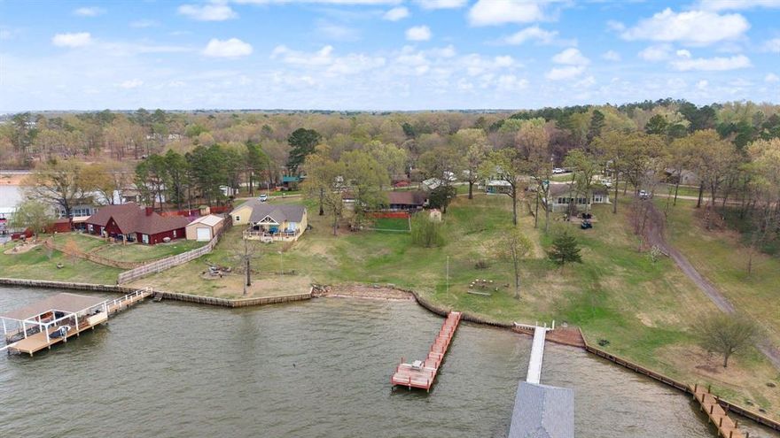 The lakefront property you’ve been waiting for! Sitting on over a half-acre lot on Lake Bob Sandlin, this charming 3-bedroom, 2.5-bath home offers amazing water views, a walk-out to the lake, and beautiful sunsets, and presents an excellent opportunity for a short-term rental, Airbnb, or income-producing vacation property. Relax or entertain on the large deck overlooking the water or unwind in the screened-in back porch with peaceful lake views. Inside, you’ll find a wonderful flowing floor plan with a bright and spacious living area featuring a cozy wood-burning stove and built-ins, all open to the dining area and kitchen. The kitchen offers a breakfast bar along with plenty of cabinet and counter space.
The spacious primary suite includes an ensuite bath with dual sinks, a large soaking tub, and a separate walk-in shower. The two additional bedrooms are located on the opposite side of the home and share a convenient Jack-and-Jill bathroom. Wonderful neighbors and a tranquil lakeside setting make this home a true retreat. Whether you're enjoying morning coffee by the water or watching the sunset from your deck, this home offers the perfect blend of comfort, nature, and lakefront living.