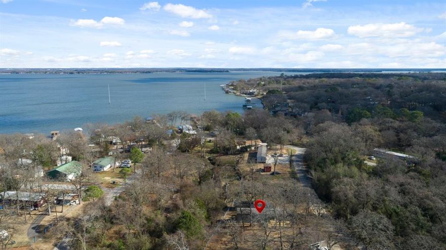 Location truly sets this home apart. Enjoy close proximity to Cedar Creek Lake, the Royal Oaks Community Park, local favorites Fig’s Backyard and Fig’s Steak House, as well as everyday conveniences like Tool City Hall, Tool City Park, and the City of Tool Police Department. Space, style, and location come together here offering a lifestyle that’s easy to enjoy and even easier to appreciate. In the Royal Oaks Subdivision, this 2025 home offers the ideal blend of modern living, space, and lake area lifestyle, all with full city services. Positioned on a large, freshly cleared double lot, this property delivers flexibility, function, and curb appeal from the moment you arrive. The huge front deck creates an immediate wow factor, while the over the top covered back porch deck is designed for relaxing evenings and entertaining, complete with a sliver view of Cedar Creek Lake and peaceful East Texas surroundings. The outdoor space is further enhanced by chain-link fencing on both sides and the back, plus a large shop with a single garage door perfect for storage, projects, or lake toys. Whether you’re seeking a full time residence, weekend escape, or a low-maintenance investment near the lake, this property checks all the boxes.