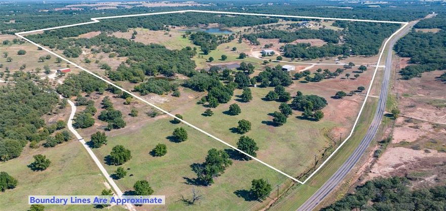 TURN-KEY RANCH LUXURY IN THE NORTH TEXAS HILL COUNTRY! Move-In ready 188 +- ac retreat in Northern Montague County, located less than 1.5hours from DFW and strategically situated between the historic town of Nocona and the charming square of Saint Jo. This property offers a 5008sf modern farmhouse main residence, a 1752sf guest cabin, a 102x60 workshop, livestock barn with working pens, rolling terrain, a gorgeous private lake with an additional two ponds, and a beautiful, gated entrance. An upscale combination ranch of productivity and recreation has been captured, fused with the idea of entertainment and full-time functionality in mind. Elevation change, a balanced mix of pasture and timber, established trails, and breath-taking views characterize this topography in its entirety.  The private lake features a fishing pier or dock if preferred, plus a peninsula and offers year-round recreational fun in the form of fishing, duck hunting, swimming, and more. Whitetail deer, turkey, and other native Montague Co wildlife flourish throughout the property and the deer feeder and stand will stay behind to encourage your own hunting memories. A60x60 insulated shop with a 42x60 shed row, bunk house, bath, walk-in cooler, and hoist can be found just up the drive from the livestock barn and working pens. The shop features both 12 and 14ft doors with RV hook ups plus its own septic system and water well.  The main home boasts 5 bedrooms, 5 full baths, two half baths, and a massive, “great room” with 24ft ceilings that is sure to impress. An idyllic, rustic themed guest cabin sits atop a hill overlooking the lake below and is outfitted with an indoor-outdoor floor to ceiling rock fireplace, a 1000sf covered deck with wraparound porch, a saloon style bar, and two additional bed and baths for entertaining. House and cabin share a septic system and water well. A third water well sits down at the lake for added convenience. Underground water lines to every pasture and all traps.