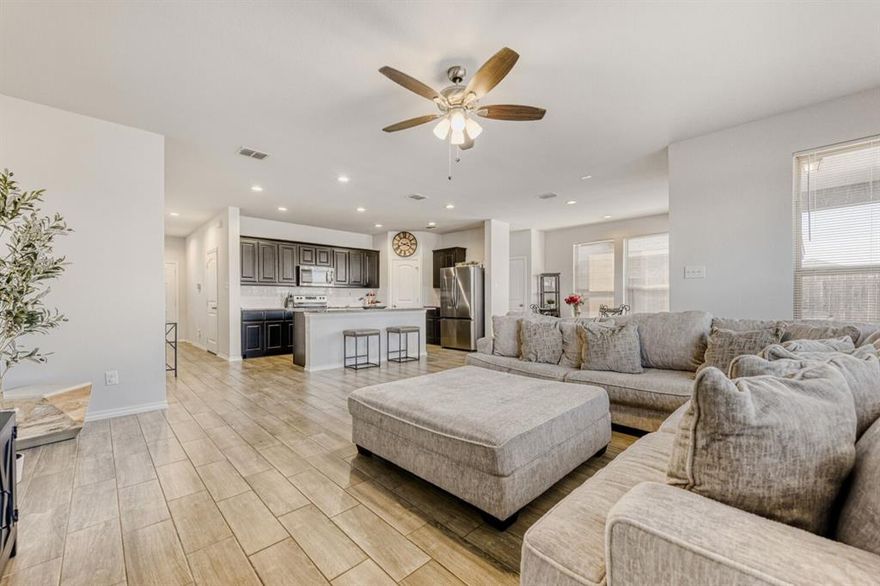 Prime corner-lot living in a peaceful, award-winning neighborhood! Located in a community recognized by the City of Fort Worth as a 2025 Neighborhood Award Winner, this home offers both pride of place and exceptional livability.

Enjoy the rare advantage of a protected adjacent lot where no future building is permitted, giving you added privacy, extra space, and long-term peace of mind. Situated on a desirable corner lot, the home provides an open and airy feel that’s hard to find.

Step inside to a bright, open layout featuring ceramic tile throughout the main level and sunlit living spaces perfect for everyday living and entertaining. The gourmet center-island kitchen showcases granite countertops, a breakfast bar, and seamless flow into the main living areas, ideal for gathering with family and friends.

Upstairs, all bedrooms are thoughtfully positioned for convenience and comfort. The spacious primary suite is privately located on one side of the home, creating a peaceful retreat with dual sinks, a soaking tub, and a separate shower. The additional three bedrooms are located on the opposite side of the upstairs level, offering a layout that works wonderfully for families who want both connection and separation of space. You'll also find convenient upstairs laundry and abundant storage throughout the home.

Out back, enjoy a fenced yard and covered rear porch, perfect for relaxing evenings, playtime, or hosting guests.

Ideally located near shopping, parks, and scenic trails, and zoned to Crowley ISD schools. Discounted rate options and no-lender-fee future refinancing may be available for qualified buyers.

Schedule your tour today to see this beautifully maintained home in one of Fort Worth’s most celebrated neighborhoods!