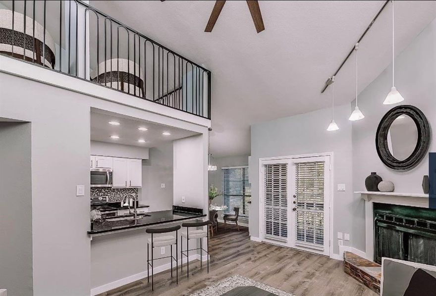 Experience upscale living in this beautifully updated 1-bedroom, 1-bath condo with a versatile loft, perfectly blending comfort and sophistication. Located on the quiet second floor of a gated community, this residence features soaring vaulted ceilings, a designer fireplace, and expansive windows that fill the space with natural light. The sleek kitchen is equipped with stainless steel appliances, while the private balcony offers tranquil views of the SoPAC Trail — ideal for morning coffee or evening relaxation. Enjoy modern conveniences including washer-dryer hookups, generous storage, and a serene atmosphere throughout. Situated near White Rock Lake, NorthPark Center, and Dallas’ premier dining and entertainment, this home offers the perfect balance of luxury and location.