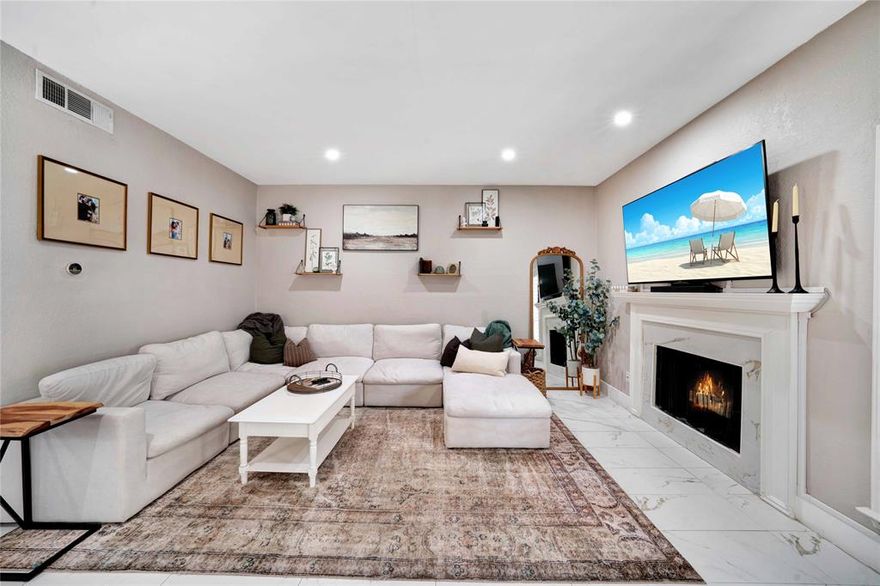 WOW! This beautifully UPDATED 2-bedroom townhome offers the perfect blend of style, comfort, and convenience. The spacious open floor plan features impressive tile flooring, a cozy fireplace, built-in shelving, and soft neutral paint accented by crisp white trim. The modern kitchen showcases dark countertops contrasted by white cabinetry and includes a breakfast bar opening to the dining area—practical for everyday living or entertaining. At Both bedrooms are located upstairs, each featuring its own private luxury ensuite bath for ultimate comfort and privacy. A Flex space loft area is an added feature. Step outside to enjoy the private patio, ready for your grill, or relaxing on your balcony after a long day. Residents enjoy access to a sparkling community pool and scenic walking paths, all conveniently located near shopping, dining, and highways.