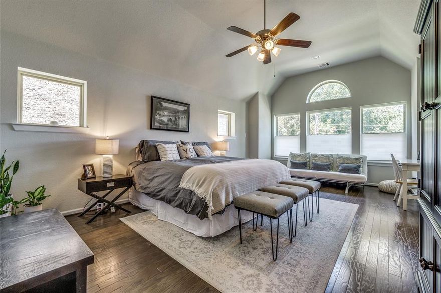 Imagine waking up every morning in a treetop retreat. The primary suite at 10565 Plumwood feels like living in a luxury treehouse with vaulted ceilings, a private sitting area, and sweeping views of mature trees with no two story neighbors behind you, ever. That rare privacy carries throughout this beautifully appointed 4 bedroom, 3 bath home tucked inside the gated Villas of Lake Highlands.
Downstairs, rich hardwood floors flow through an open concept layout designed for both everyday living and effortless entertaining. The gourmet kitchen is the heart of the home with crisp white cabinetry, dramatic black soapstone countertops, a subway tile backsplash, pot filler, walk in pantry, and a large center island with breakfast bar seating. The adjacent dining area opens to a covered patio and a low maintenance fenced backyard, where the absence of rear neighbors means you'll actually use the outdoor space. A gas fireplace anchors the living room, plantation shutters dress every window, and designer lighting sets the mood throughout. The spa inspired primary bath offers a soaking tub, glass enclosed shower, and dual vanities. Three additional generously sized bedrooms, a flexible upstairs nook perfect for a home office, and a dedicated laundry room round out an incredibly livable floorplan. All of this within a gated community featuring a resort style pool, lush park, and green space with top rated Lake Highlands Elementary (9 out of 10 GreatSchools) just 0.8 miles away, and premier shopping, dining, and commuter routes minutes from your door.
This is the one you've been waiting for. Schedule your private showing today.