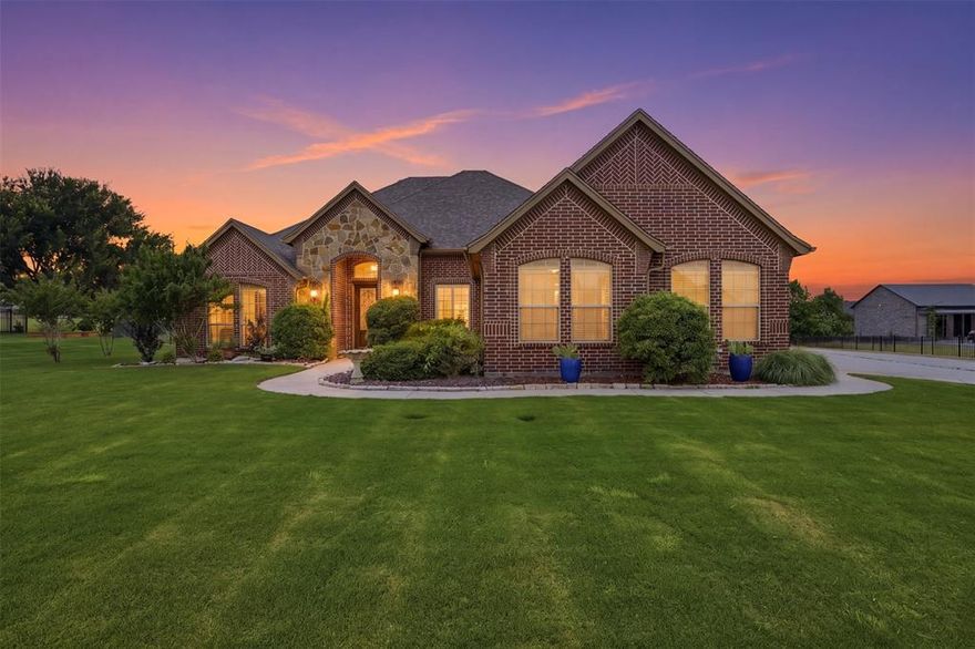 Beautifully maintained home in Mustang Pointe, a neighborhood where each home shows pride in ownership. This home is on a one-acre lot, landscaped, featuring a peach and pear tree, blackberries, and two young fig trees in the backyard. Upon entry you will notice the sleek hardwood floors that span the living room, dining room, primary bedroom, and hall. Neutral, earthy colors throughout. Living room flanked by a stone, wood burning fireplace. Southern shutters on nearly all windows. First secondary bedroom features a French door, allowing it to be an office, gym, flex room if desired. Half bath ready for guests. Large secondary bath. Each secondary bedroom has a spacious closet. Primary bathroom recently renovated, featuring quartz counters, quartz around tub, porcelain tile. Kitchen has center island, granite counters, stainless appliances, kitchen fridge can stay. Separate utility room, washer, dryer can stay. Three car garage. Water softener. Fantastic location with multiple access routes by 377, 1187, and tollway. Recently deep cleaned, carpets cleaned and ready for new owner.