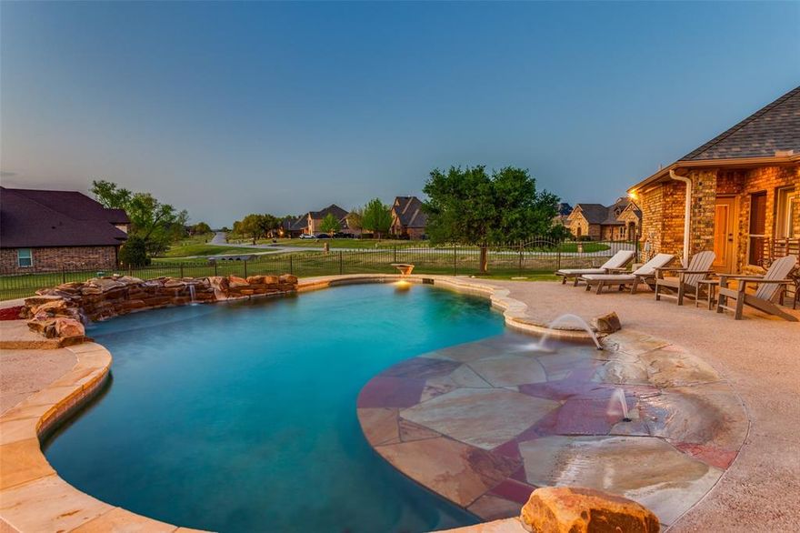 Welcome to your private retreat on 1.3 picturesque acres in one of the area’s most distinctive and desirable neighborhoods—famously recognized as a filming location for Landman. This unique community offers not only a sense of exclusivity but also a welcoming atmosphere.

Set back with plenty of space and privacy, this beautifully appointed home features 3 spacious bedrooms, 3 full bathrooms, and a convenient half bath, thoughtfully designed to provide both comfort and functionality. The 3-car garage offers ample room for vehicles, storage, or even a workshop setup.

Step outside and discover a true backyard oasis designed for both relaxation and entertaining. The resort-style pool is the centerpiece, featuring a beach-style entry for easy access, a diving board for added fun, and a stunning water feature that creates a tranquil ambiance. Whether you’re enjoying a quiet evening swim or hosting a lively summer gathering, this outdoor space delivers an unforgettable experience.

Elevating the entertainment possibilities even further is the incredible party barn—an ideal flex space for celebrations, game days, or simply unwinding with friends and family. Complete with a covered porch, the barn opens seamlessly to the pool area, creating a natural flow between indoor & outdoor living spaces and making it perfect for year-round enjoyment.

Beyond the fenced yard, the property continues, offering additional acreage that enhances both privacy & potential. Whether you envision creating a garden, adding recreational features, or simply enjoying the open space, the possibilities are endless.

With its rare combination of acreage, amenities, & community charm, this property offers a lifestyle that’s hard to find. From peaceful mornings  to vibrant evenings by the pool, every detail invites you to slow down, spread out, & truly feel at home.

Don’t miss the opportunity to own a one-of-a-kind property that perfectly balances luxury, comfort, & a connection to nature.