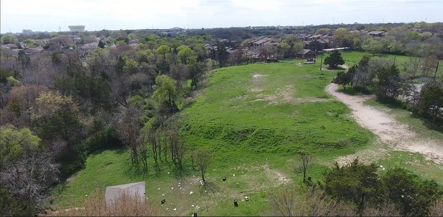 Beautiful Creekside land with quick access to I20, Highway 67, and Highway 12. Rare opportunity to own, develop and build on over 13 acres of land total but also selling separately 2 parcels 4+ or 8+ acres. 

See 4212 and 4232 Corral Dr. A segment of 5 Mile Creek splits the property in half and has flowing water running thru it. Call for more information. Property has a covered gazebo, wooden stage and bricked garage on the property. City water, sewer and electricity all available to service the land. Nearby features include Dallas Executive Airport, the Shops at Redbird, and UT Southwestern Medical Center at Redbird. Many other developments on the way.