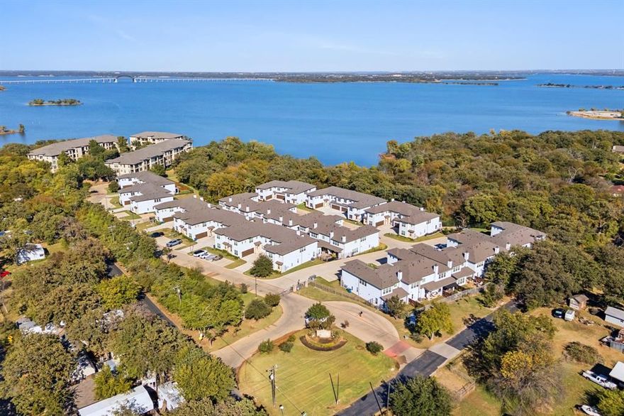This property may be eligible for up to $10,000 in a Buyer Assistance down payment grant with builder's preferred lender! This is a great opportunity to make home ownership more affordable. Contact agent for more details. Located along the coveted shoreline of Lewisville Lake, Water’s Edge is a luxury, townhome-style, mid-rise condominium residence in Lake Dallas. Nestled amidst a perpetual forest of trees, you’ll discover an oasis of natural beauty with all the urban conveniences and entertainment close at hand. With magnificent lake views and a waterfront deck, you’ll love coming home to Water’s Edge. Final 14 new units are complete and ready for move in. Built by Crescent Estates, they offer 5 different floorplans ranging from 2087 square feet to 2372 square feet, 2 and 3 bedrooms plus game room, study and or loft. Residents also have access to lakefront clubhouse, fitness center & community pool. 428 Waterscape #1339 features the Catalina floorplan. Condos are Fannie Mae approved!