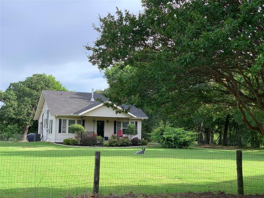 Charming Remodeled Home on 3.73 Acres in City Limits — Prime Location! Discover the perfect blend of country space and city convenience with this beautifully remodeled 2-bedroom, 1-bath home sitting on over 3 acres inside the city limits. All rooms are exceptionally large, offering a spacious feel throughout the home. Step inside to find a welcoming living area, a formal dining room, a cozy breakfast nook, and a separate laundry room for added convenience. The home has been thoughtfully updated while maintaining its original charm. Enjoy quiet mornings and relaxing evenings on the large covered front porch, overlooking a driveway lined with beautiful crepe myrtles. The acreage surrounding the home is fully fenced, making it ideal for pets, gardening, or simply enjoying privacy and open space. A workshop provides additional storage or hobby space, perfect for projects or equipment.
Located just behind the hospital with quick access to Hwy 75, this property offers unbeatable convenience while still giving you room to breathe.
This is a rare find — spacious, updated, and privately set on over 3 acres right in town! Seller may be willing to subdivide if buyer wants less acreage and lower price. Can be used as light commercial.