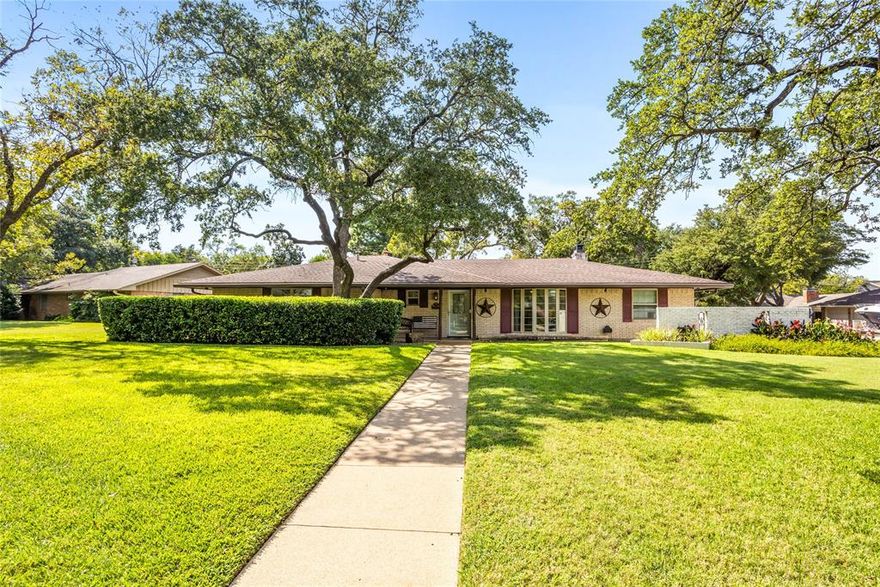 Charming home perfectly situated on corner lot in Forest Park neighborhood with mature trees and luscious landscaping. Step inside to a welcoming layout of formal living and dining perfect for entertaining. This 4 bedroom, 3 bath gem offers a perfect blend of comfort and character. Spacious kitchen with ample storage and counter space. Enjoy outdoor living in this large backyard perfect for family fun. Some of the many features of this home are whole house generator, triple pane windows, extra insulation, oversized garage and access to backyard for RV or boat parking. Home is located minutes from AT&T stadium, Globe Life Park, amusement and water park. Easy access to major highways, shopping, restaurants and entertainment. A must see!!
